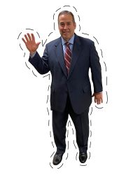 A cut out of Commissioner Trevino waving and smiling.
