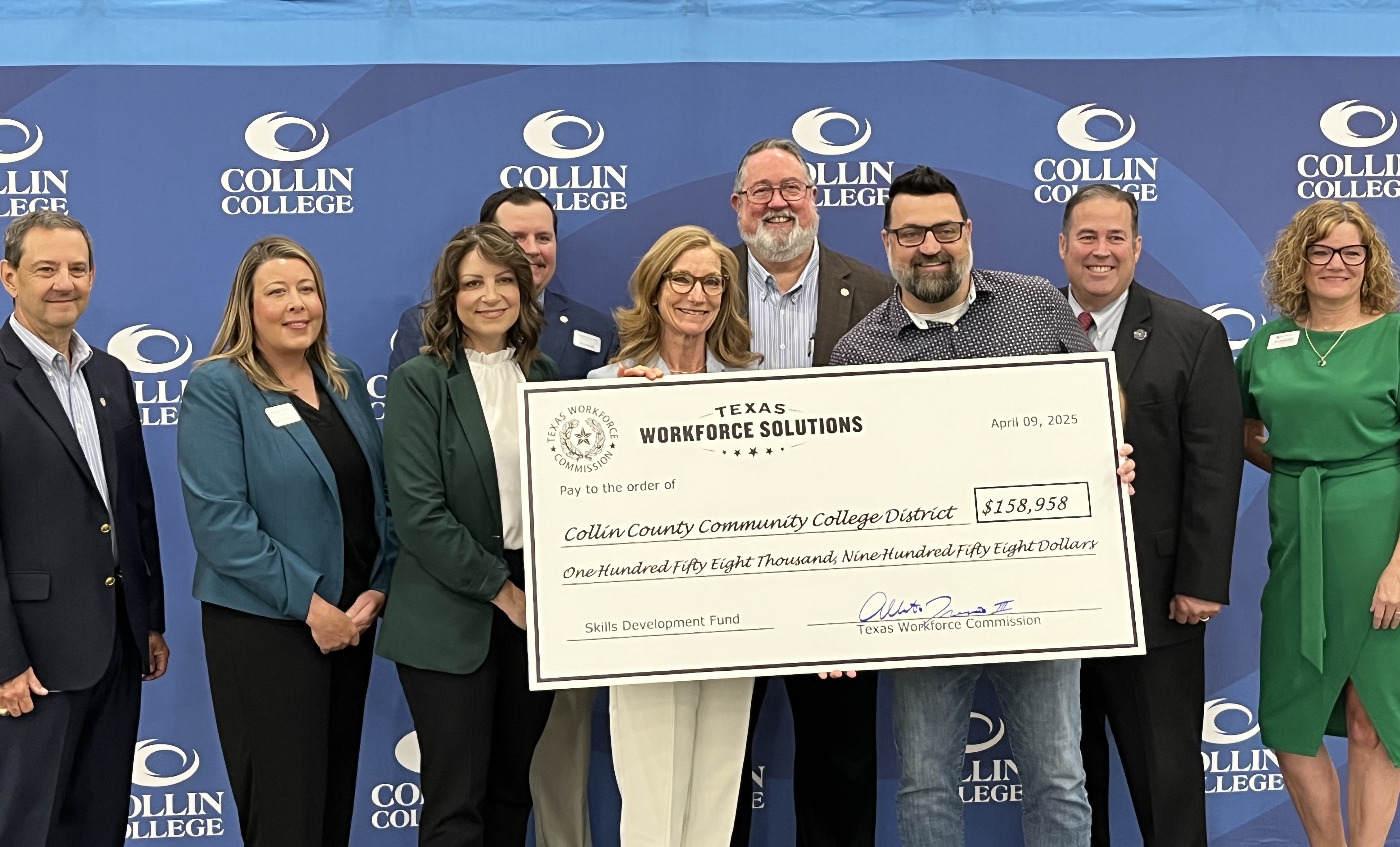 TWC Commissioner Representing Labor Alberto Treviño III presents a ceremonial Skills Development Fund grant check to Collin College
