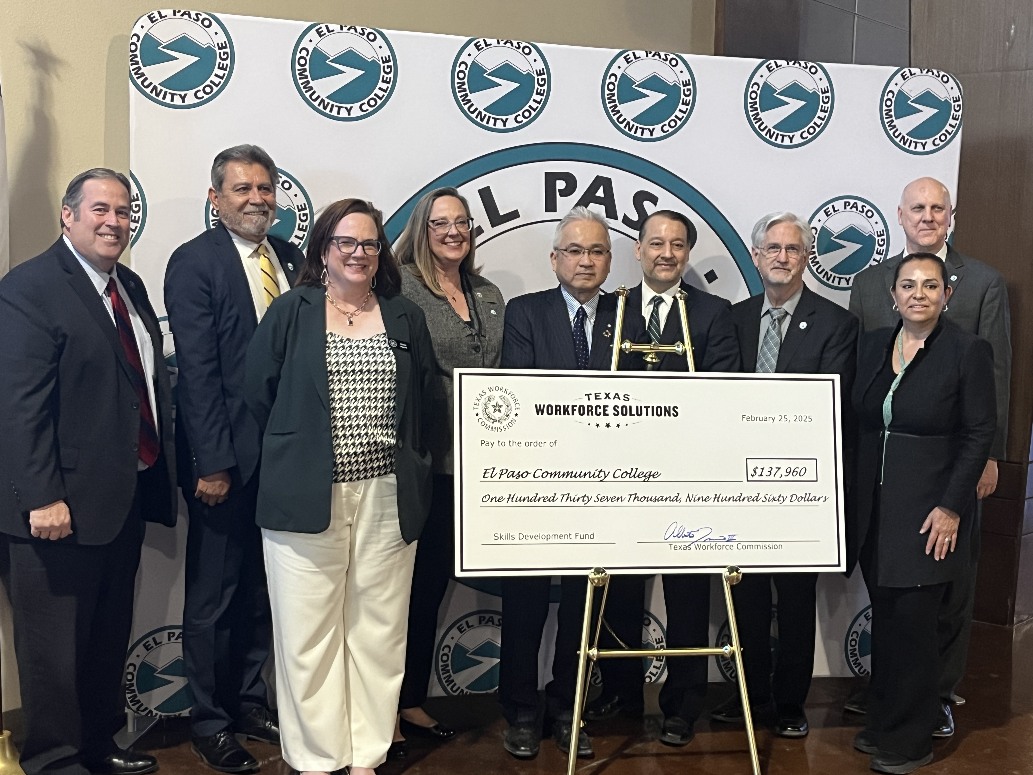 Commissioner Treviño presents a big check to representatives from El Paso Community College and local business partner.
