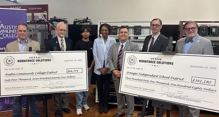 TWC Commissioner Representing Employers Joe Esparza stands with local partners behind two ceremonial JET grants.