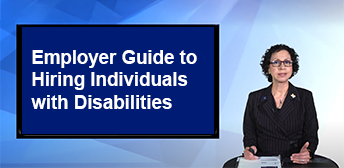 A woman standing in front of a presentation that says 'Employer Guide to Hiring Individuals with Disabilities'