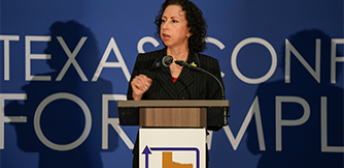 A speaker presenting at the Texas Conference for Employers.