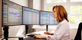 A woman looking at analytics on her computer.