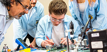 A group of students receiving training in a technical field.