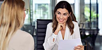 A woman completing an interview with the assistance of WorkInTexas AI interview prep features.