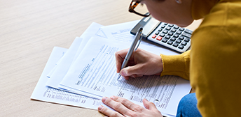 Someone filling out their taxes