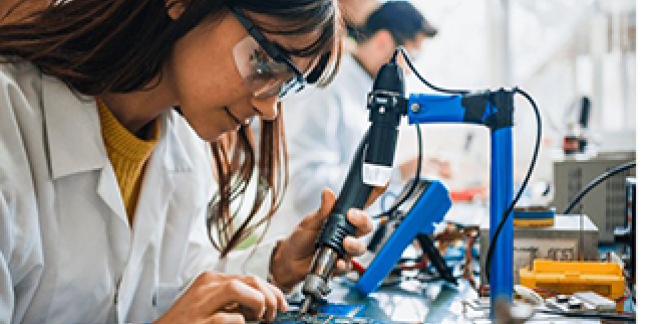 A woman working with machinery