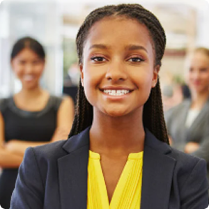 A young black woman wearing business attire.