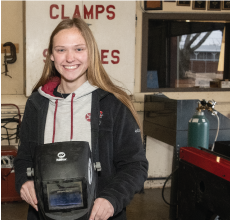 JET Student posing with a welding mask