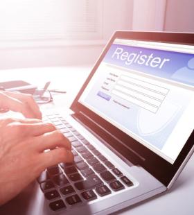 Laptop open to web page to register