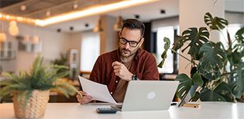 A man completing his layoff claim taxes